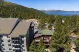 Experience breathtaking lake and mountain views from this stunning property, nestled amidst a lush pine forest.