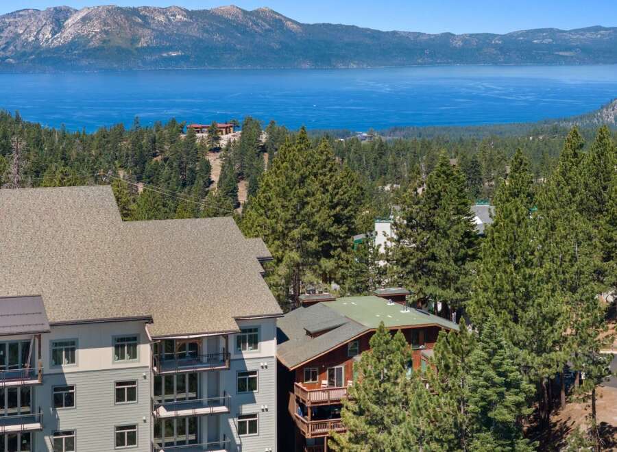 Experience breathtaking lake and mountain views from this stunning property, nestled amidst a lush pine forest.