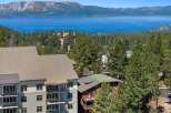 Experience breathtaking lake and mountain views from this stunning property, nestled amidst a lush pine forest.