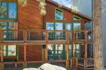 Experience mountain living in this charming wooden home featuring multiple levels of decks perfect for enjoying the crisp air and scenic views.