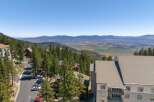 Experience breathtaking panoramic views from this stunning mountain property, nestled amidst towering pine trees.