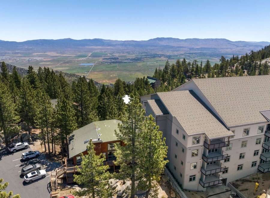 Experience breathtaking mountain views from this stunning property, featuring modern architecture and a prime location amidst lush pine forests.
