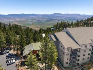 Experience breathtaking mountain views from this stunning property, featuring modern architecture and a prime location amidst lush pine forests.