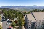 Experience breathtaking panoramic views from this stunning property nestled amidst towering pine trees.