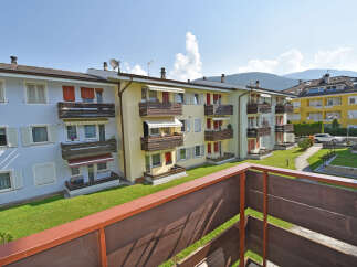 Discover comfortable living in this charming apartment complex, featuring multiple balconies with scenic mountain views.