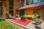 Enjoy outdoor living on this spacious wooden deck, perfect for entertaining or relaxing.