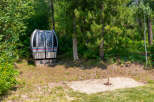 Discover a unique property featuring a vintage ski lift gondola, offering a nostalgic touch to your outdoor space.