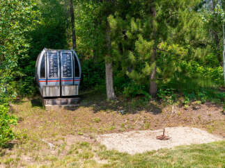 Discover a unique property featuring a vintage ski lift gondola, offering a nostalgic touch to your outdoor space.