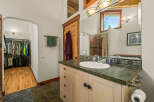 This charming bathroom features a spacious walk-in closet with ample storage for all your clothing needs.