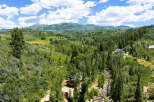 Nestled amidst a lush, verdant landscape, this property offers a serene mountain retreat.