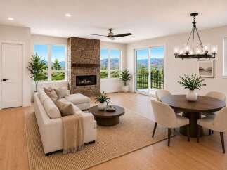 Experience breathtaking mountain views from this stunning living and dining area, featuring a modern sectional sofa, a cozy brick fireplace, and a stylish round dining table perfect for entertaining.