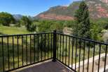 Enjoy breathtaking mountain views from this stunning property, featuring a spacious deck perfect for outdoor living.