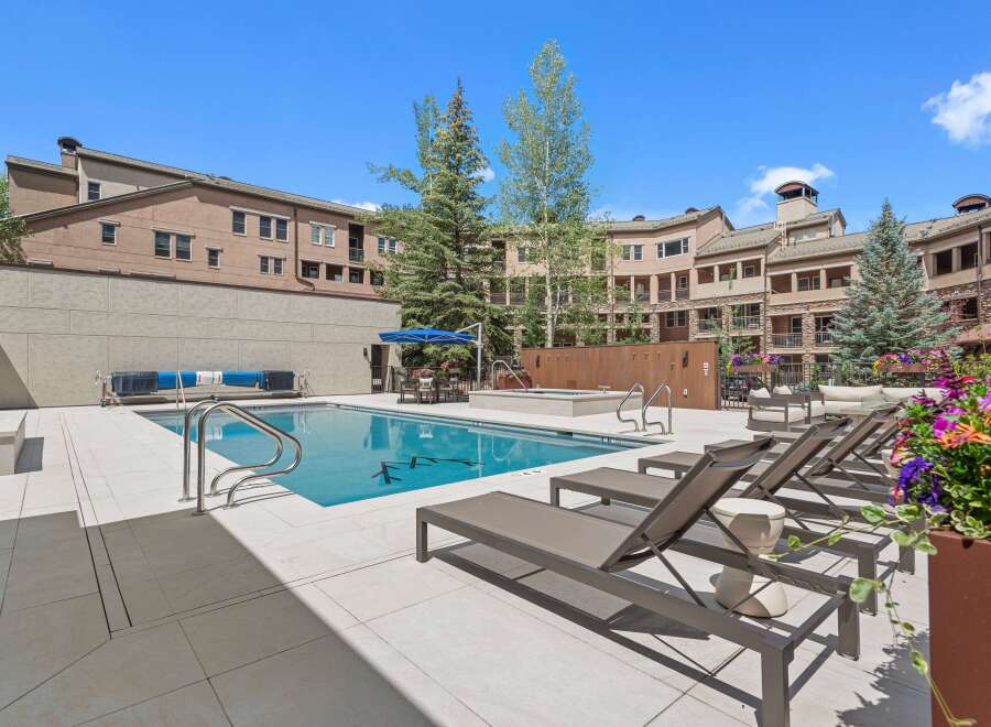 Enjoy resort-style living with this stunning outdoor oasis, featuring a sparkling swimming pool and a relaxing hot tub perfect for unwinding.