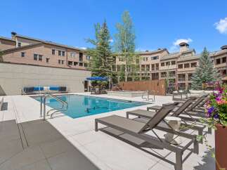 Enjoy resort-style living with this stunning outdoor oasis, featuring a sparkling swimming pool and a relaxing hot tub perfect for unwinding.