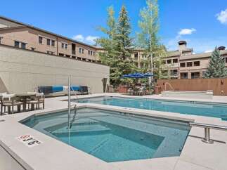 Enjoy a refreshing dip in this stunning outdoor pool and spa area, perfect for relaxation and entertainment.