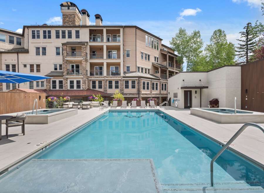 Experience luxury living with this stunning property featuring a sparkling swimming pool and relaxing hot tub, perfect for unwinding.