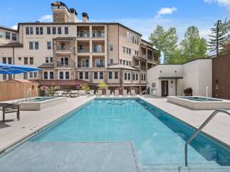 Experience luxury living with this stunning property featuring a sparkling swimming pool and relaxing hot tub, perfect for unwinding.