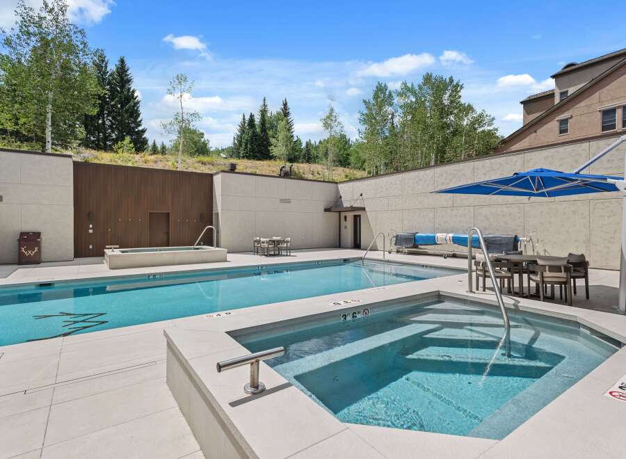 Experience luxury outdoor living with this stunning swimming pool and spa area, perfect for relaxation and entertainment.
