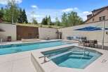 Experience luxury outdoor living with this stunning swimming pool and spa area, perfect for relaxation and entertainment.