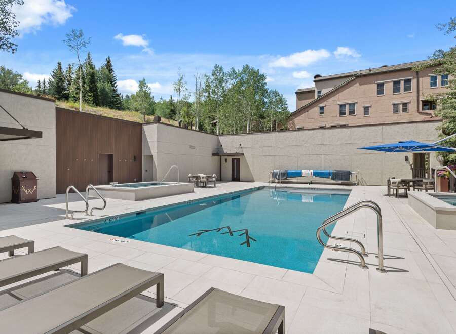 Experience luxury outdoor living with this stunning swimming pool and spa area, perfect for relaxation and entertainment.