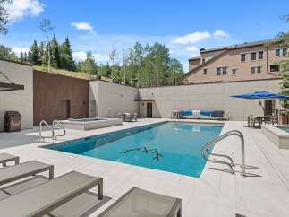 Experience luxury outdoor living with this stunning swimming pool and spa area, perfect for relaxation and entertainment.