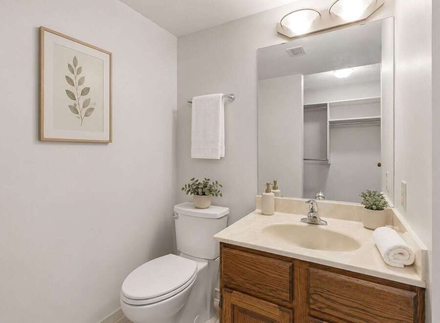 This bathroom features a clean and bright aesthetic with a neutral color palette.