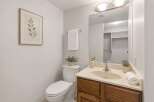 This bathroom features a clean and bright aesthetic with a neutral color palette.