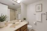 This bathroom features a clean and bright aesthetic with a neutral color palette.