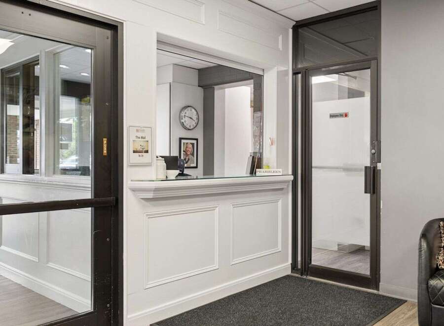 Welcome guests into a professional and inviting space with this well-appointed reception area.