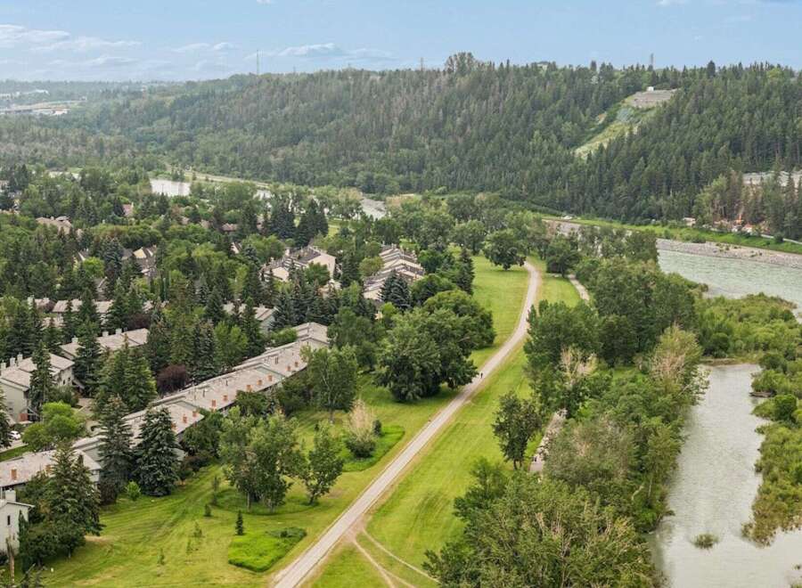 Discover this stunning property nestled amidst lush greenery and adjacent to a serene river.
