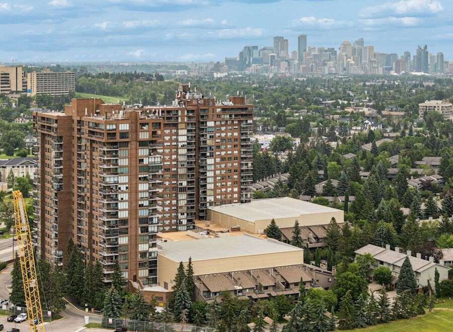 Experience luxury living in this stunning high-rise apartment complex, offering breathtaking city skyline views.
