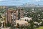 Experience luxury living in this stunning high-rise apartment complex, offering breathtaking city skyline views.
