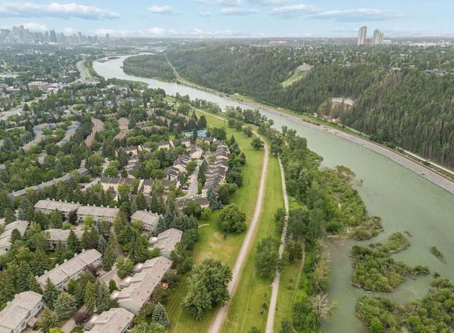 Experience serene living in this picturesque community nestled alongside a tranquil river.