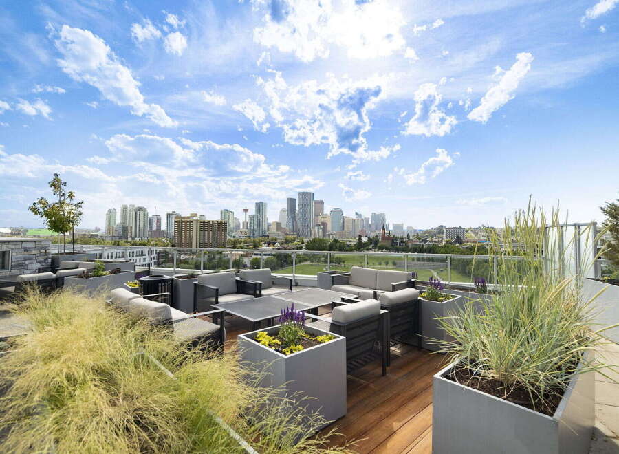 Experience luxury urban living with this stunning rooftop patio, offering breathtaking city skyline views.
