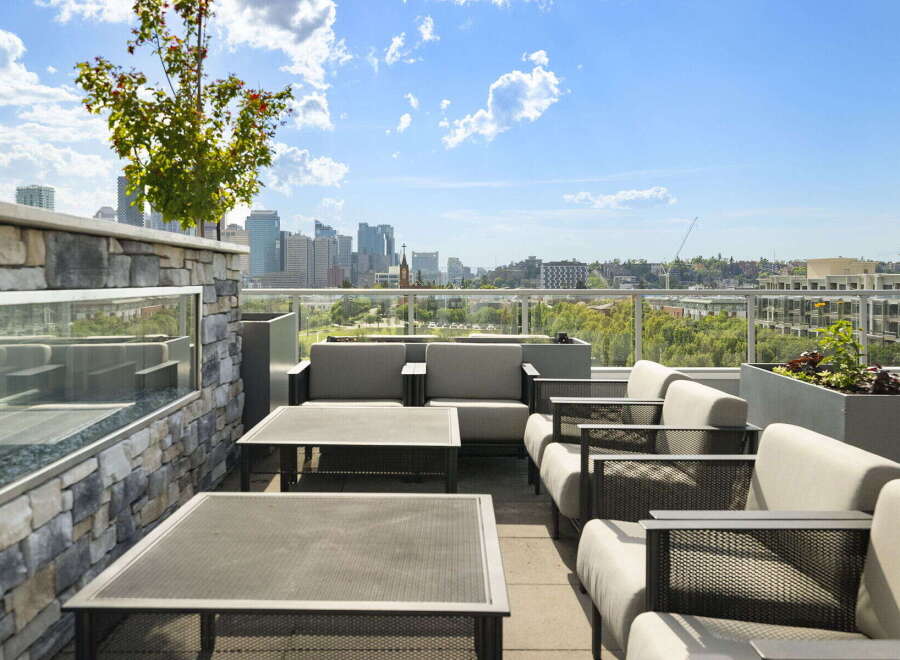 Experience breathtaking city views from this stunning rooftop patio, perfect for entertaining or relaxing.