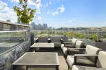 Experience breathtaking city views from this stunning rooftop patio, perfect for entertaining or relaxing.