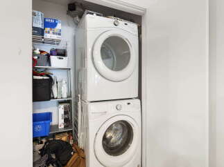 Maximize your laundry space with this efficient stacked washer and dryer unit, perfect for apartments or smaller homes.