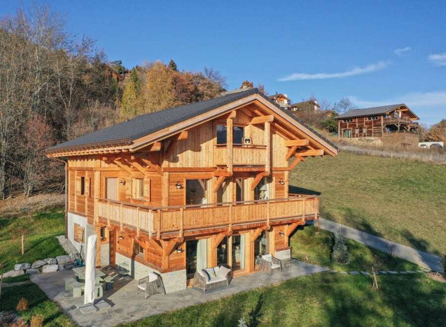 Experience luxury mountain living in this stunning timber-frame chalet, nestled on a picturesque hillside with breathtaking views.