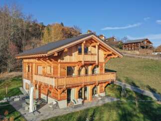 Experience luxury mountain living in this stunning timber-frame chalet, nestled on a picturesque hillside with breathtaking views.