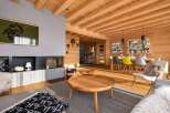 Experience rustic charm and modern comfort in this stunning log cabin living space.