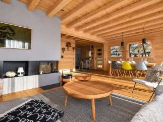 Experience rustic charm and modern comfort in this stunning log cabin living space.