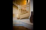 Ascend to the upper levels of this charming home via a beautifully crafted wooden staircase.