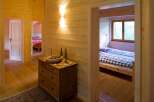 Experience rustic charm in this cozy wooden cabin, featuring two inviting bedrooms.