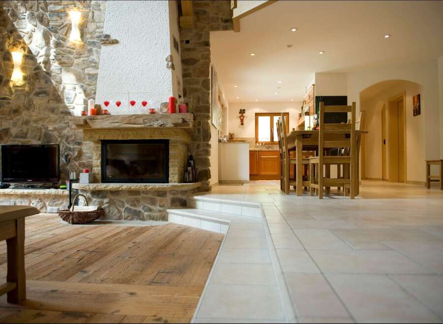 Experience rustic charm in this open-concept living space, featuring a magnificent stone fireplace as the centerpiece.