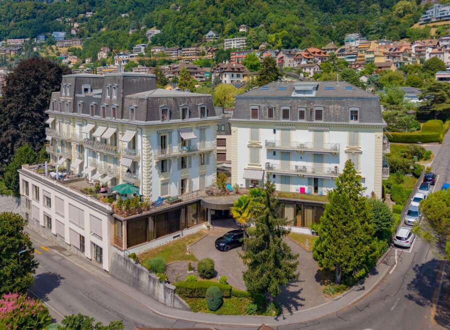 Discover this stunning property featuring elegant architecture and multiple balconies offering picturesque views.