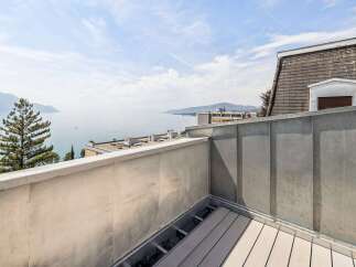Enjoy breathtaking lake and mountain views from this stunning rooftop terrace.