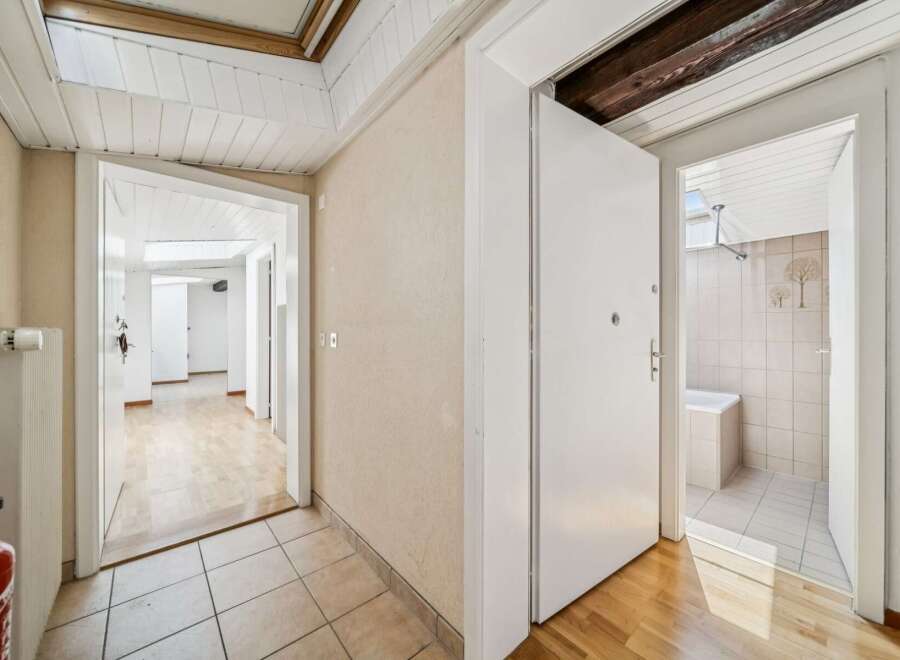 Step into this inviting hallway featuring a bright and airy atmosphere, perfect for a welcoming entrance.
