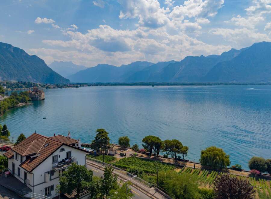 Experience breathtaking lake and mountain views from this stunning property, ideally situated near a historic castle.