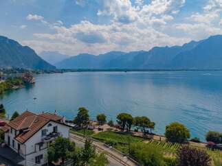 Experience breathtaking lake and mountain views from this stunning property, ideally situated near a historic castle.