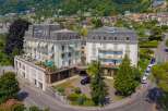 Discover this stunning property featuring elegant architecture and multiple balconies offering picturesque views.